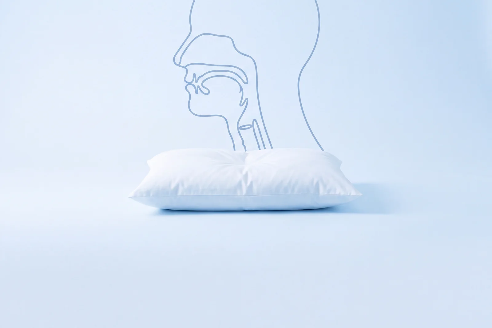 A single pillow, with a line-drawn head in profile and its open airway behind it